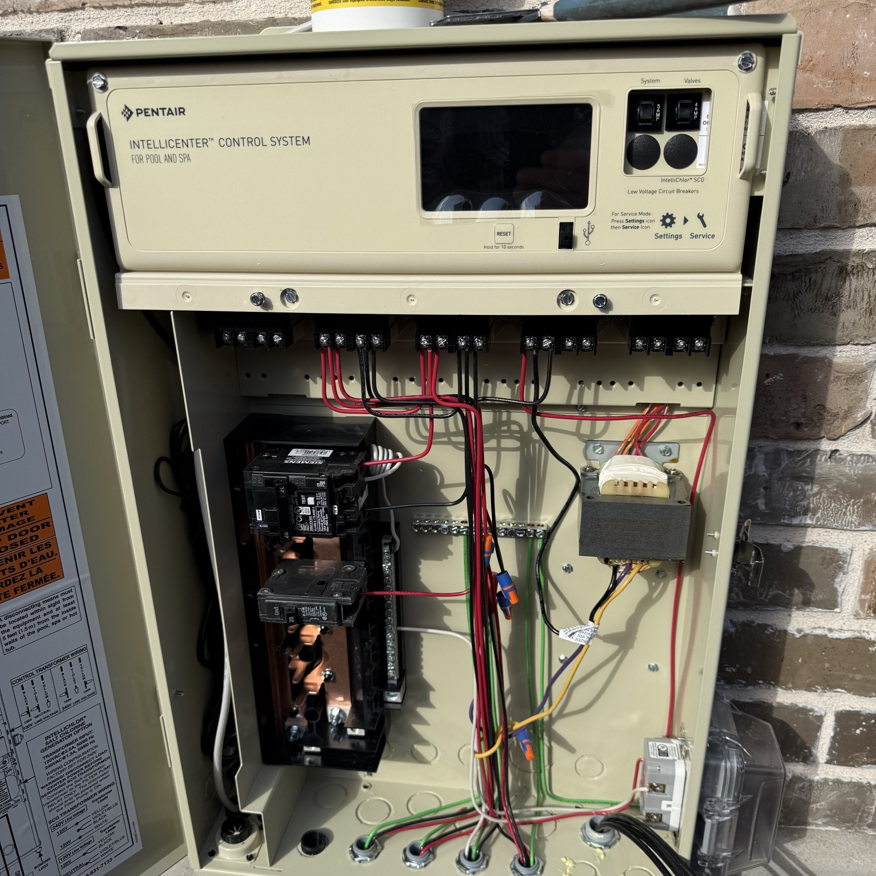 Cleanly wired pool equipment control cabinet